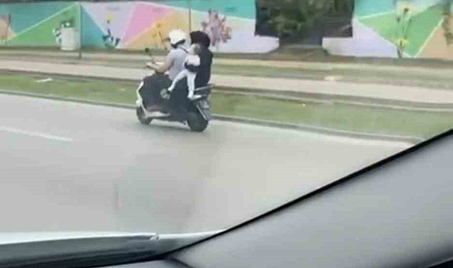 Eşi ve bebeğiyle ekipmansız halde iki teker üzerinde yolculuk yaptı